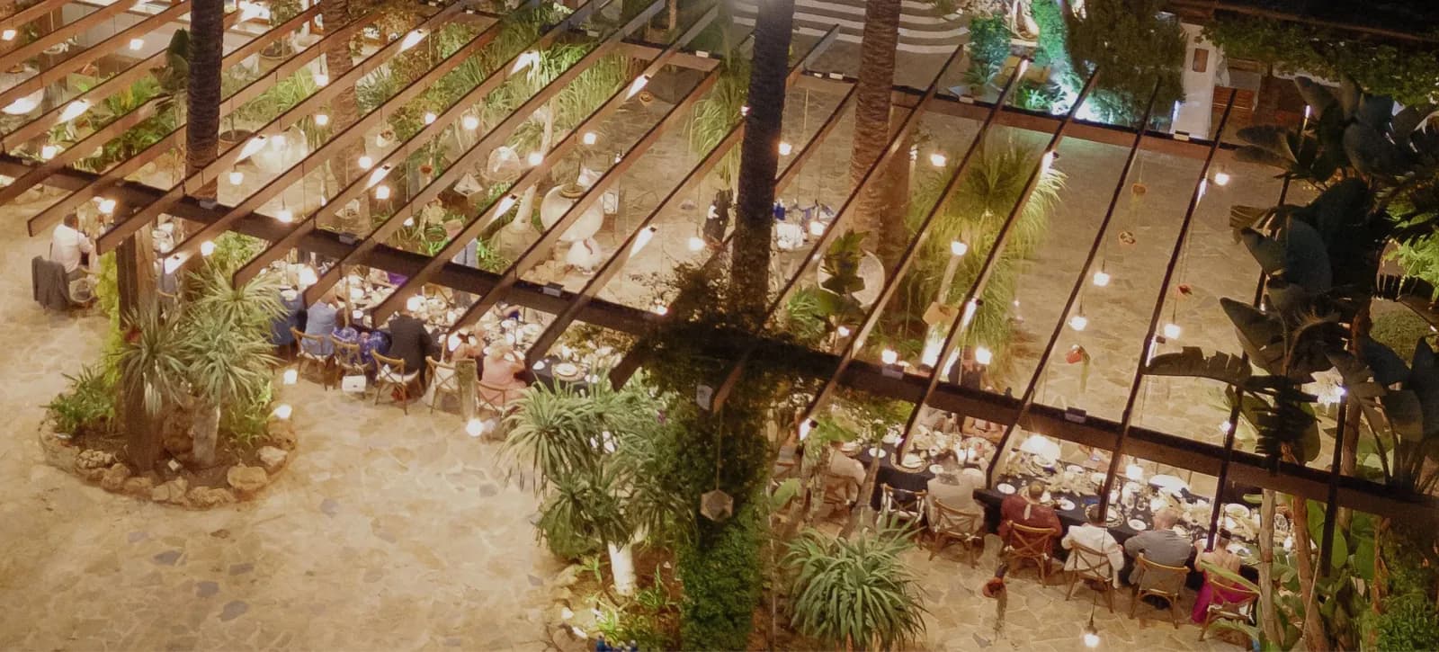 Aerial view of an event space under a pergola at Atzaro agroturismo in Ibiza