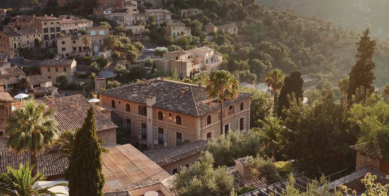 Aerial view of hotel La Residencia and stone houses in Deià village