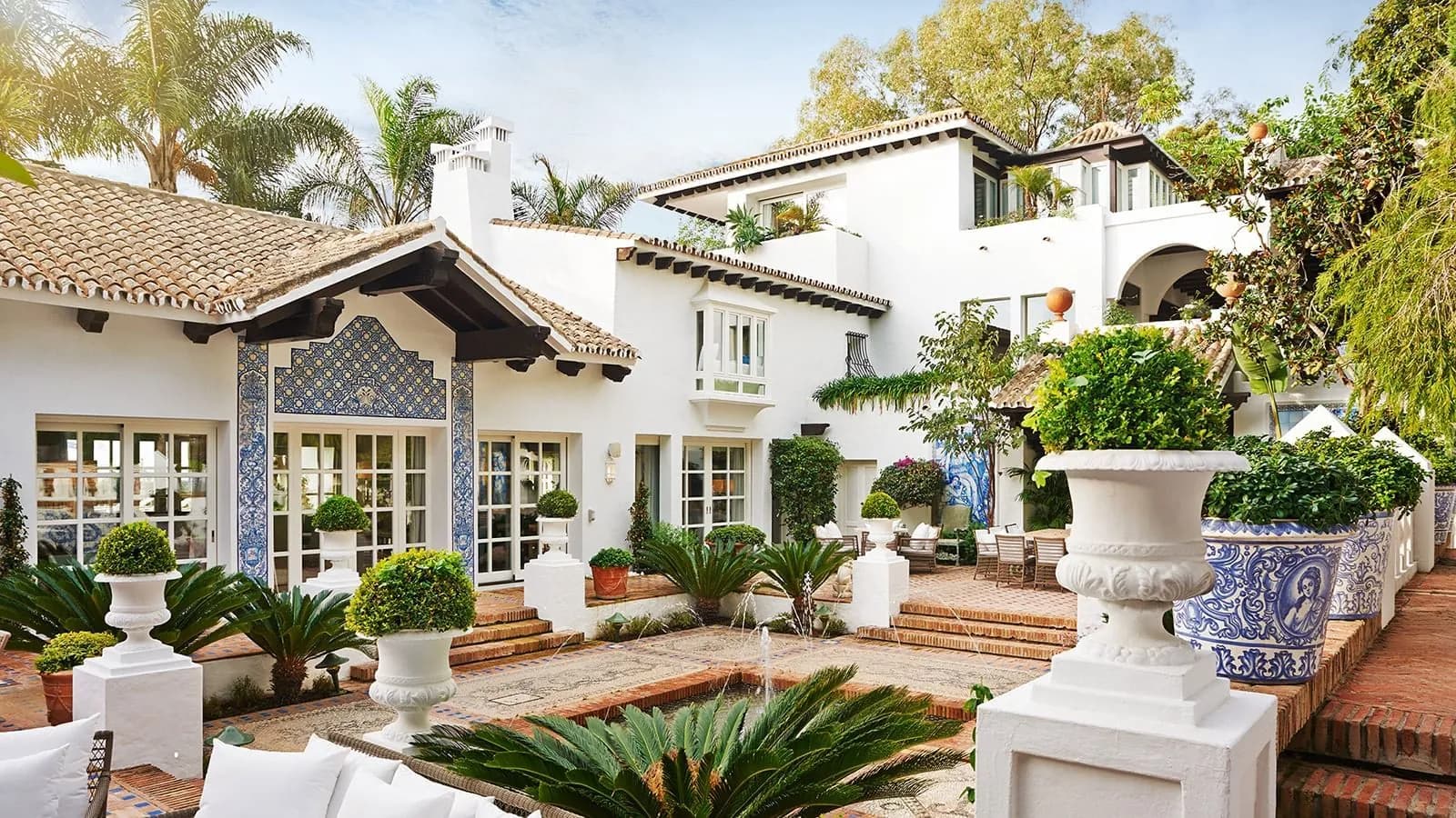 Villa facade and flowered courtyard at Marbella Club Hotel in Marbella