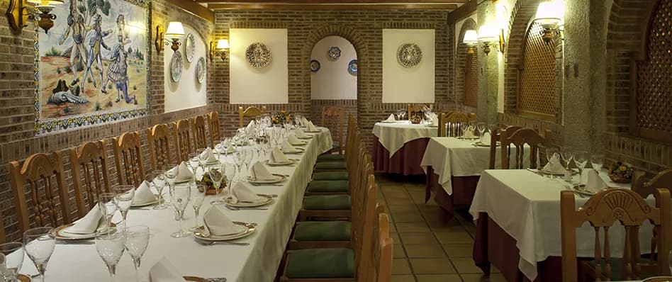 Asador Real dining room with set tables in central Madrid