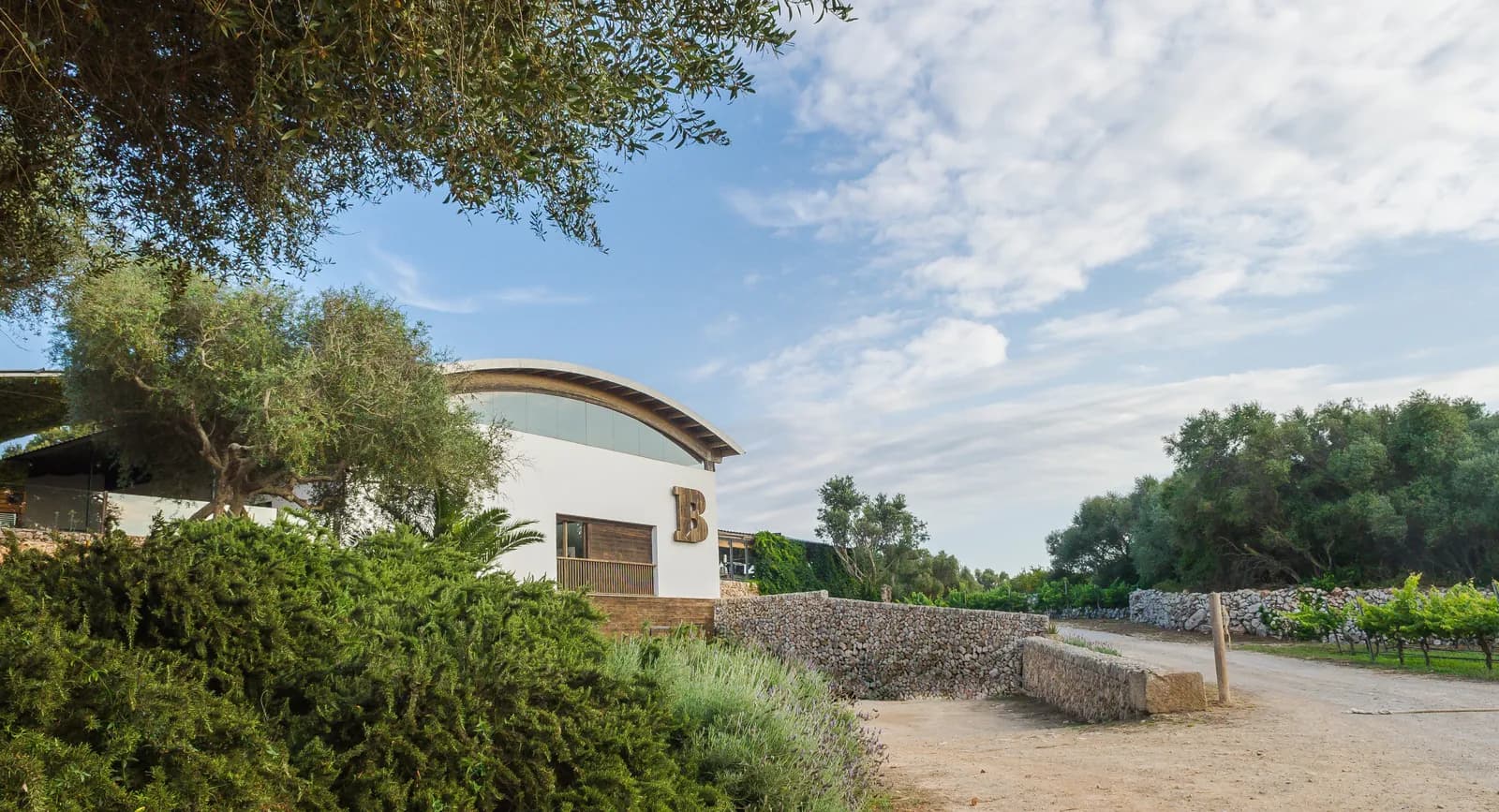 Binifadet winery building among trees in Sant Lluís, Menorca