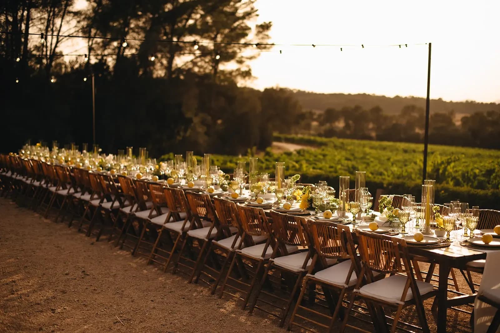 Long outdoor reception table at sunset at Finca Serena, Mallorca