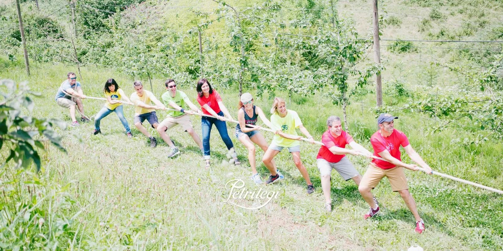 Team tug-of-war, group activity at Petritegi cider house in Astigarraga