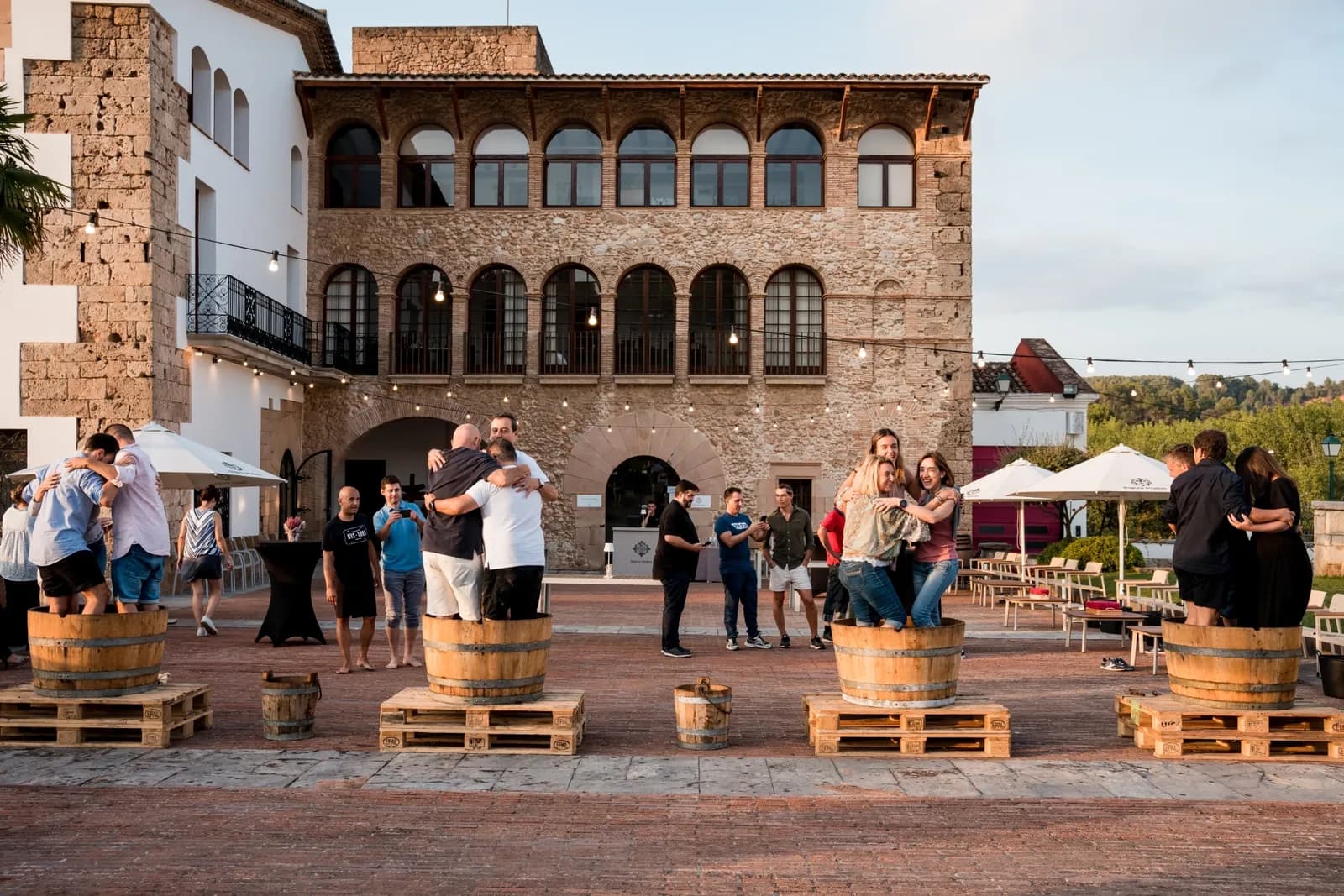 Estate courtyard with barrels during an evening event