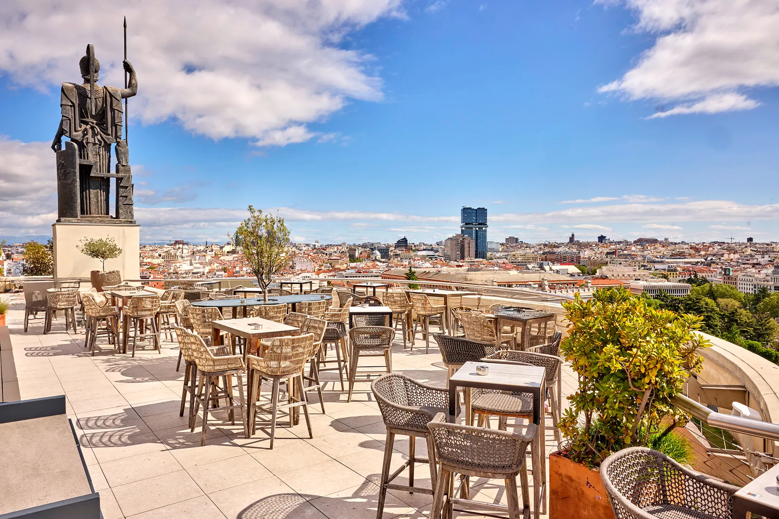 Azotea terrace at Círculo de Bellas Artes with wicker armchairs and Madrid views