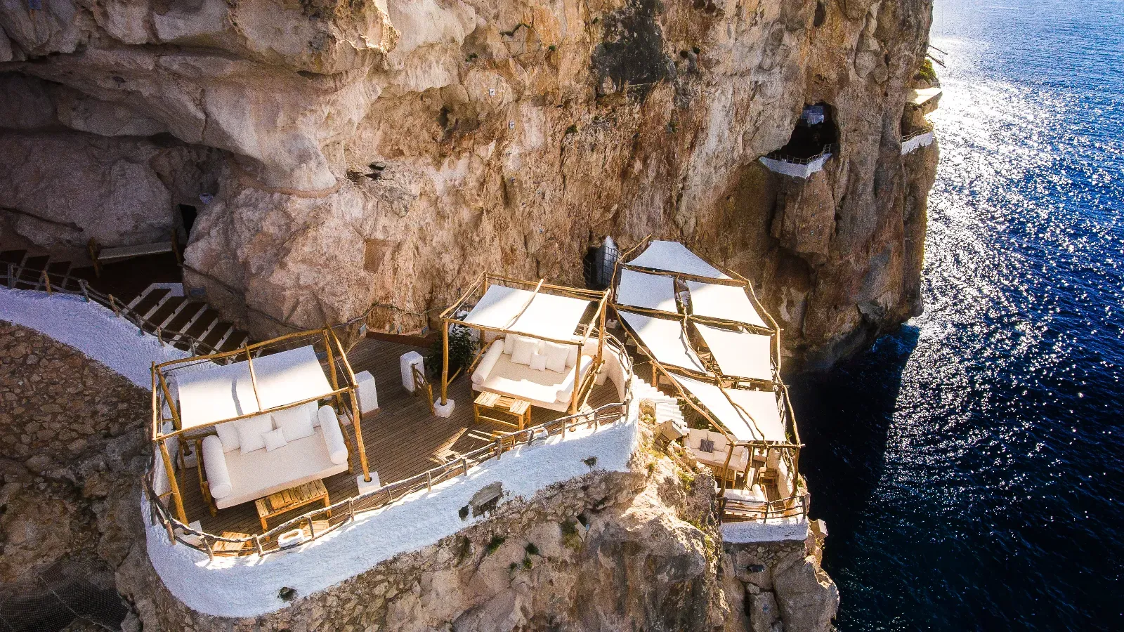 Cova d'en Xoroi carved into the cliff, terraces and sea in Menorca