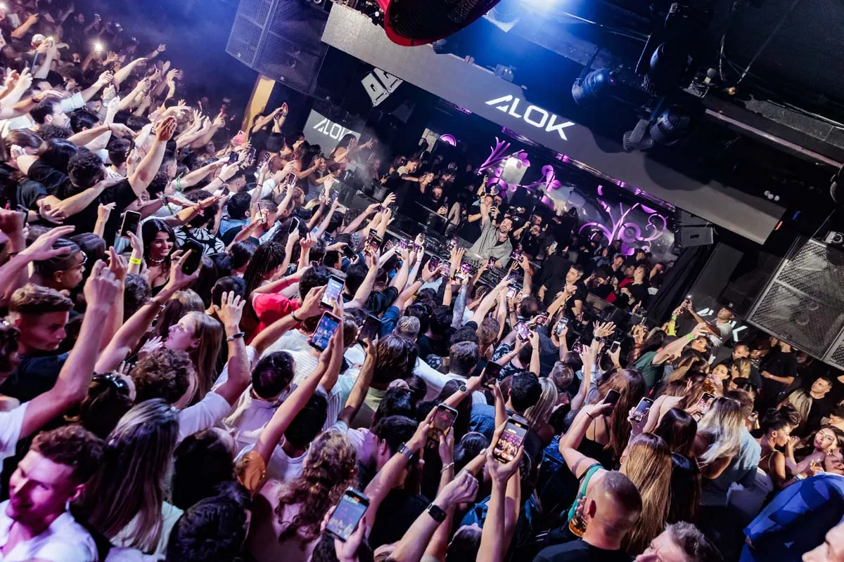 Opium Barcelona crowd with raised hands during a night event