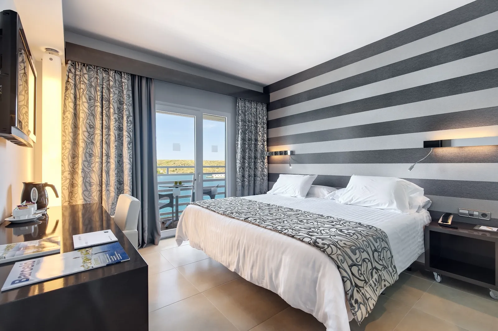 Guest room with sea-view window at Barceló Hamilton Menorca hotel