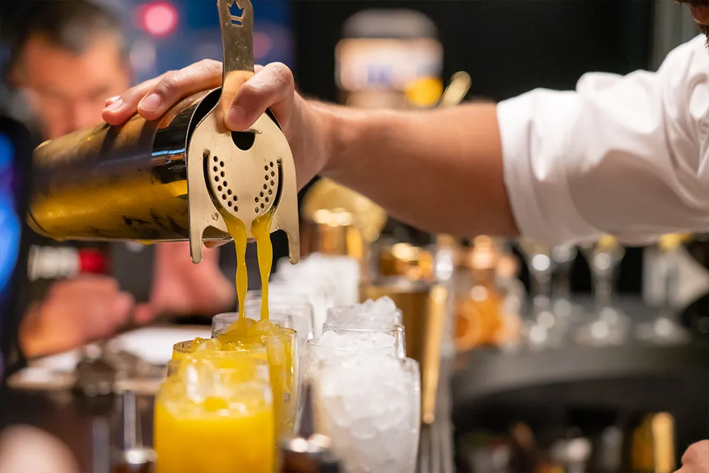 Bartender preparing a cocktail at the bar of Puente Colgante hotel in Portugalete