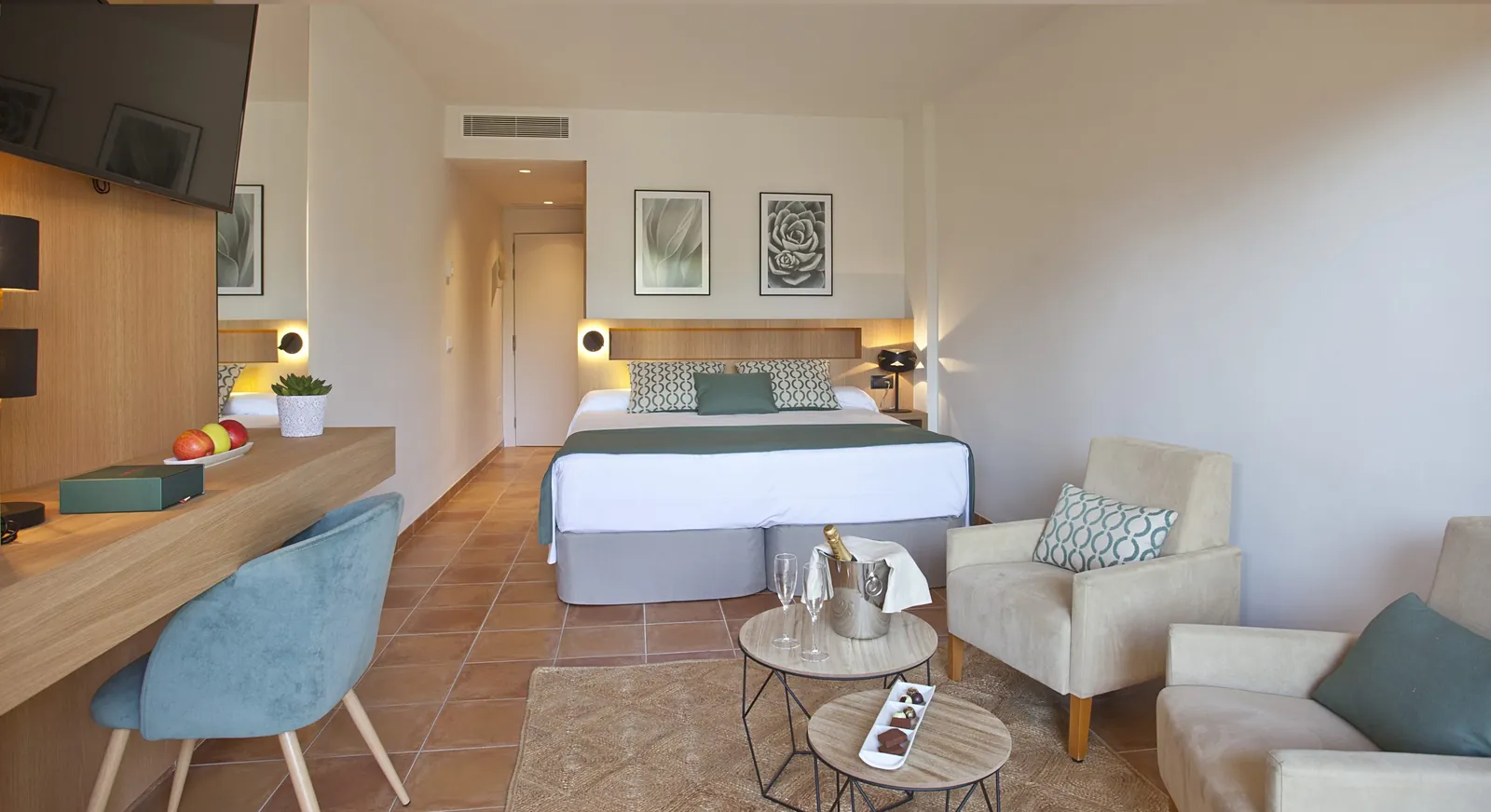 Double room at Mon Port Hotel & Spa with armchairs and desk in Port d'Andratx