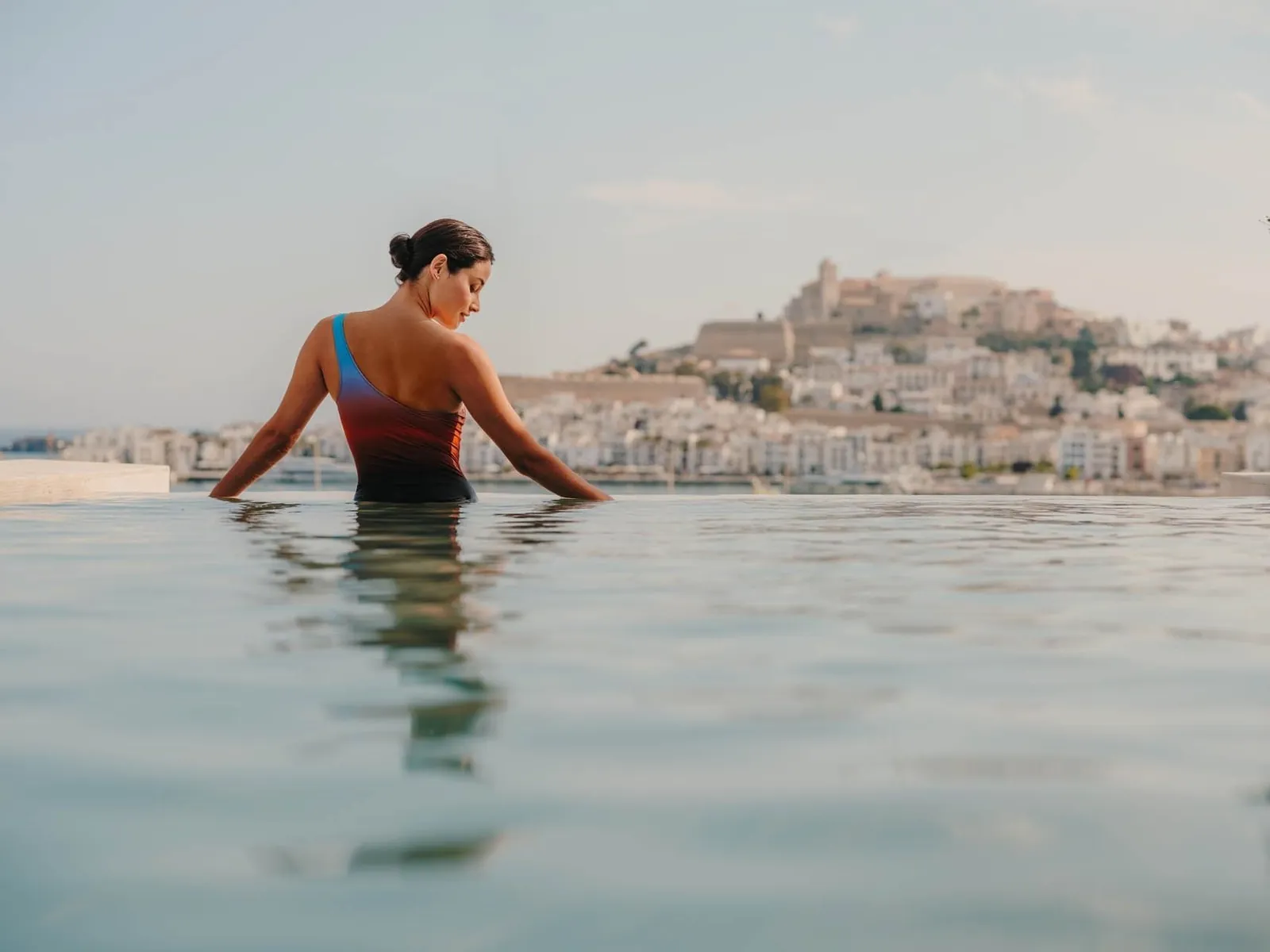 Pool at Ibiza Gran Hotel with a view of Dalt Vila, the old town of Ibiza