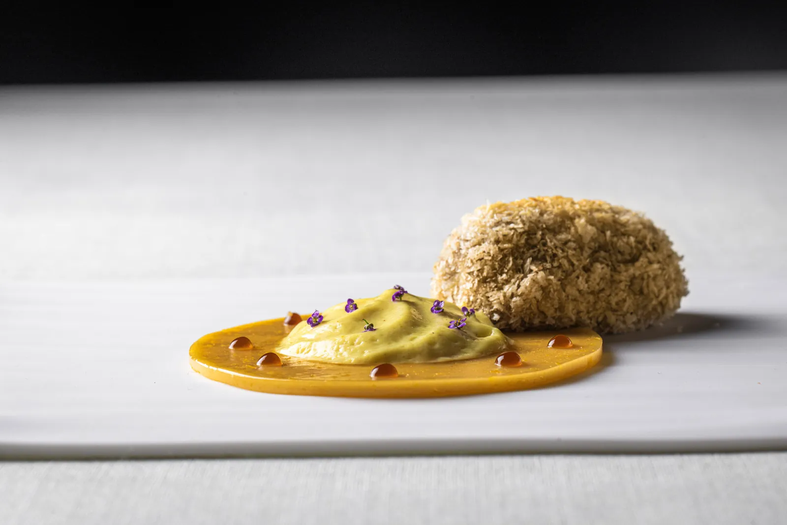 Gourmet dish plated at Abantal restaurant in Seville