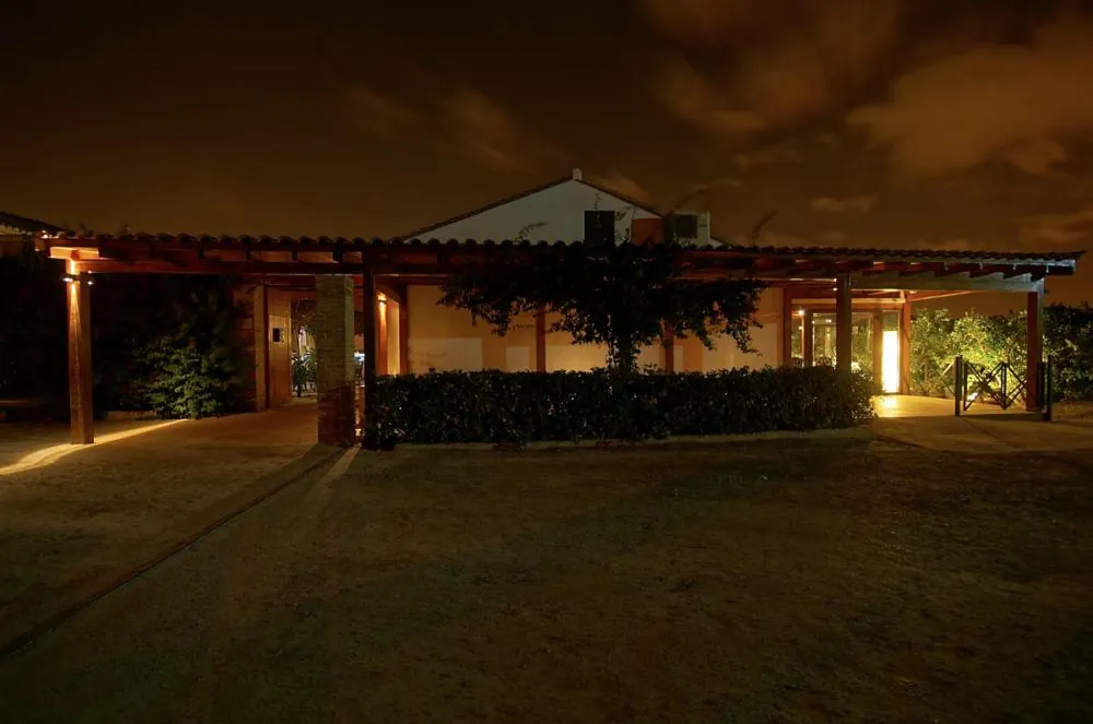 Lit building and pergola at night at Alquería del Brosquil near Valencia