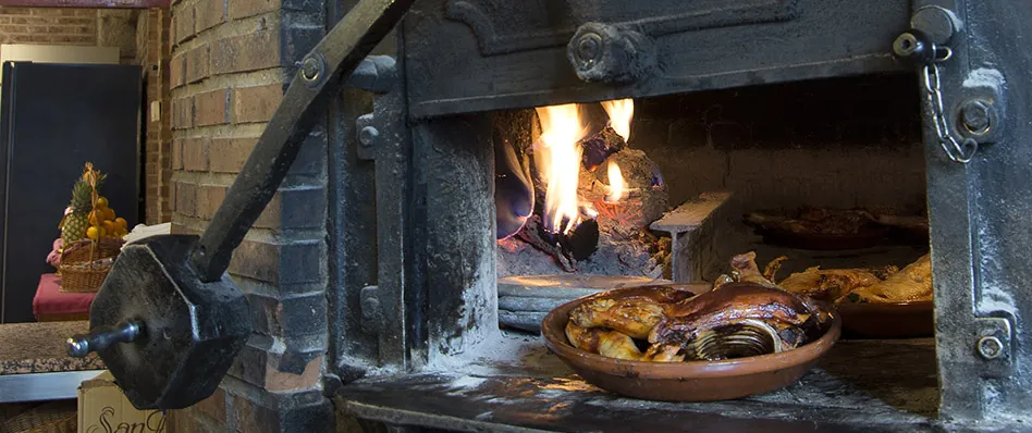 Wood-fired oven of Asador Real used for roasts in Madrid