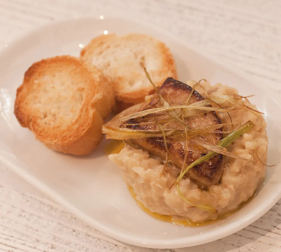 Risotto pincho served on a plate at Bar Bergara in Donostia-San Sebastián