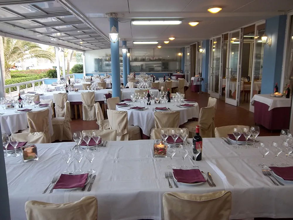 Dining room of La Pepica in Valencia with white-clothed tables