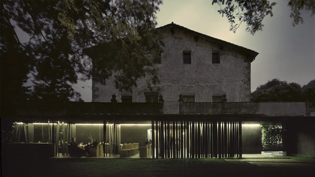 Evening exterior view of Les Cols restaurant in Olot