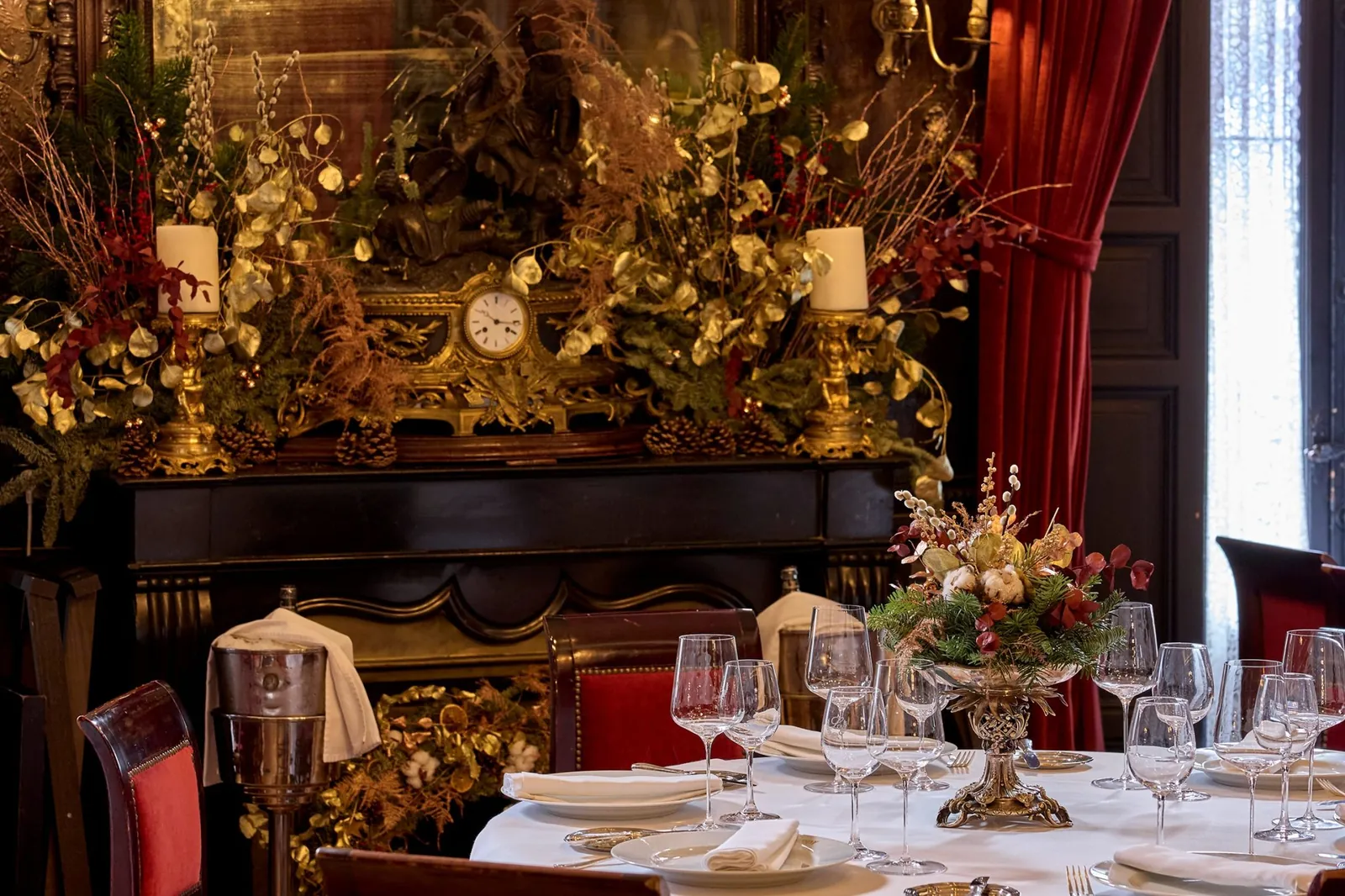 Festive table set with flowers and candles at Lhardy in Madrid