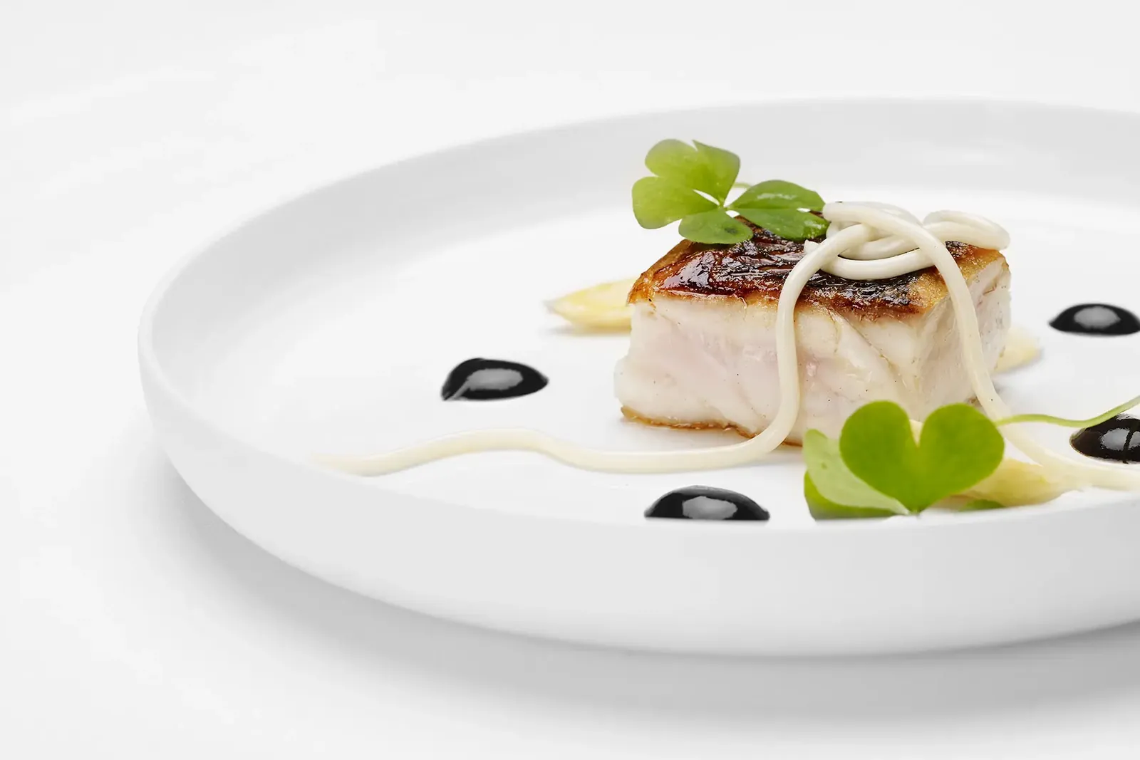 Roasted sea bream with black sauce at Marc Fosh restaurant in Palma