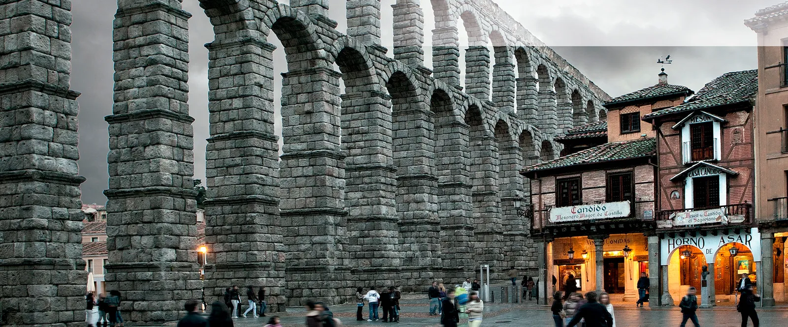 Mesón de Cándido in Segovia, facade and arches of the Roman aqueduct on the square