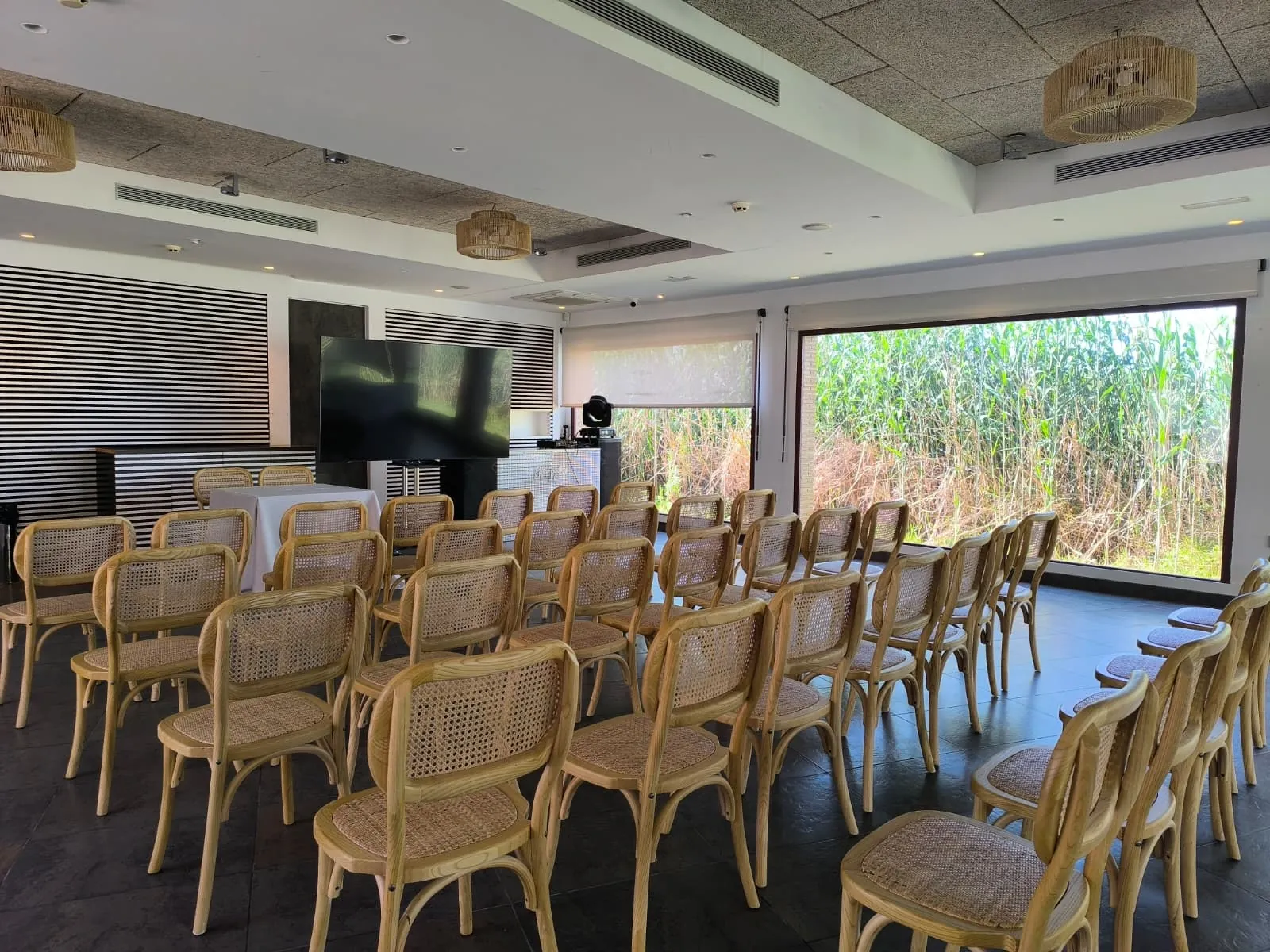 Nou Raco meeting room in Valencia, rows of chairs facing a screen