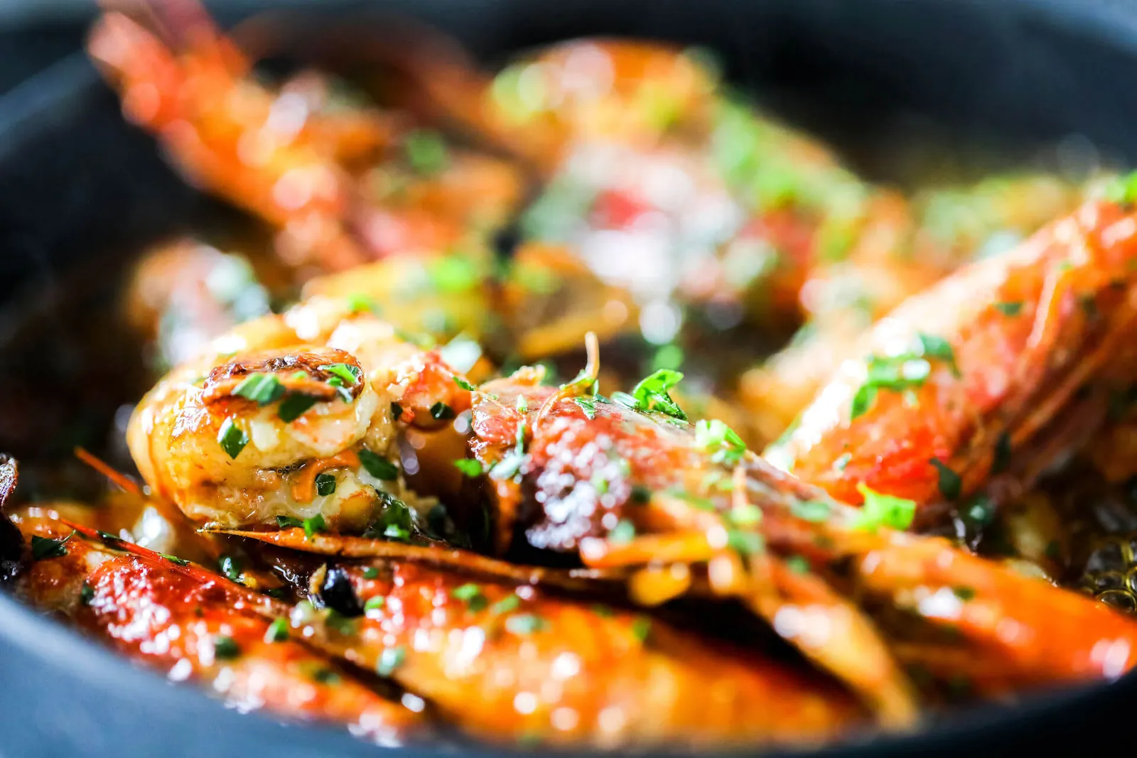 Roasted prawns in a pan at Okun restaurant in Palma