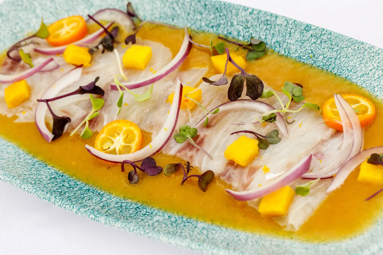 Fish ceviche with mango and citrus served at Okun restaurant in Palma