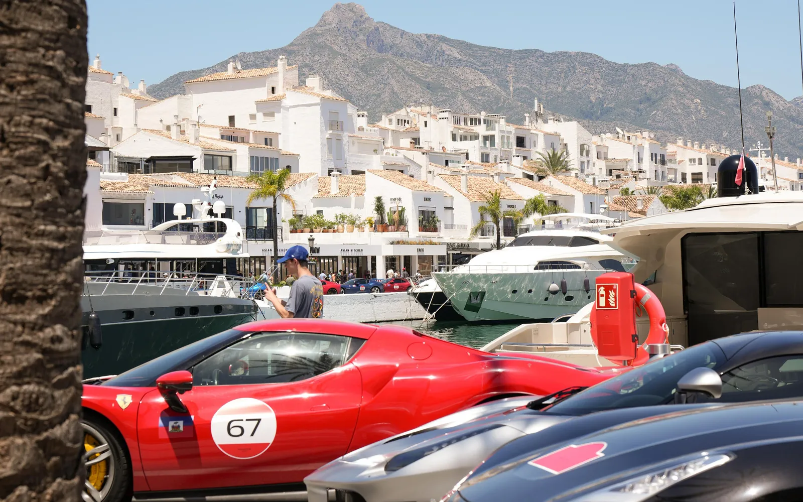 Puerto Banús marina with yachts and mountains near PiCú Seafood in Marbella