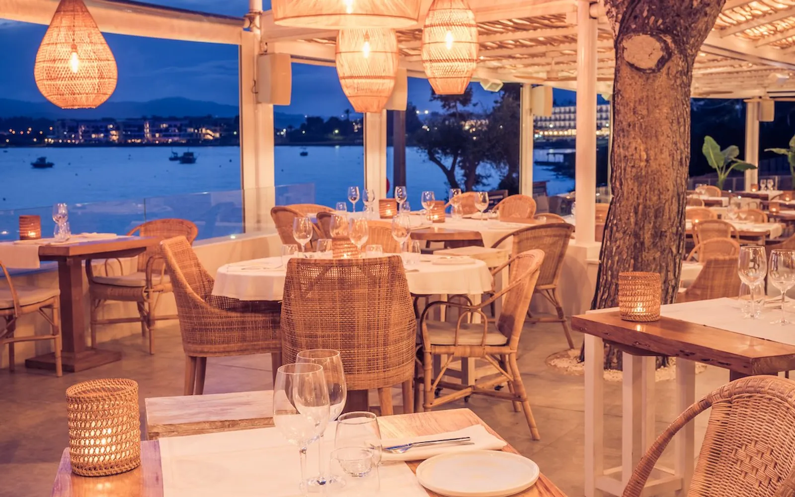 Sa Punta restaurant room at dusk with a view over Ibiza bay