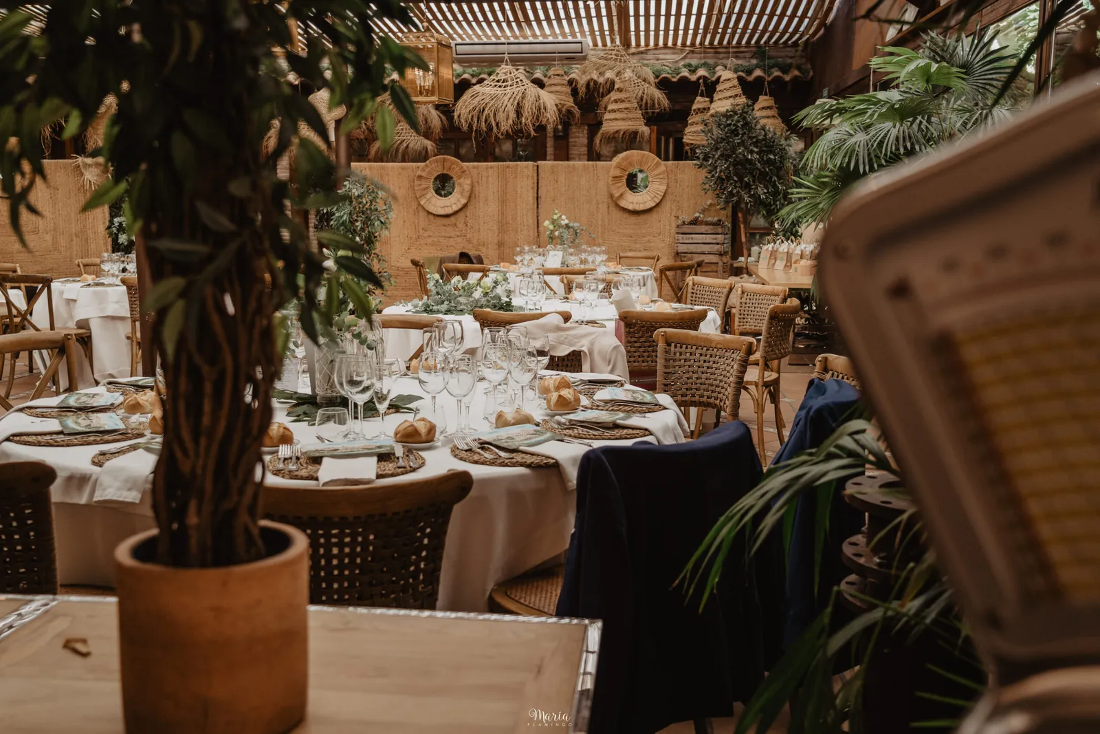 Venta de Aires restaurant dining room in Toledo, round tables and potted plants