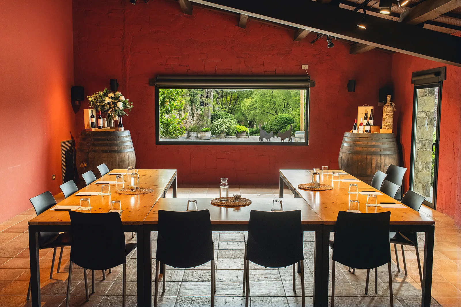 Tasting room with red walls and long meeting tables