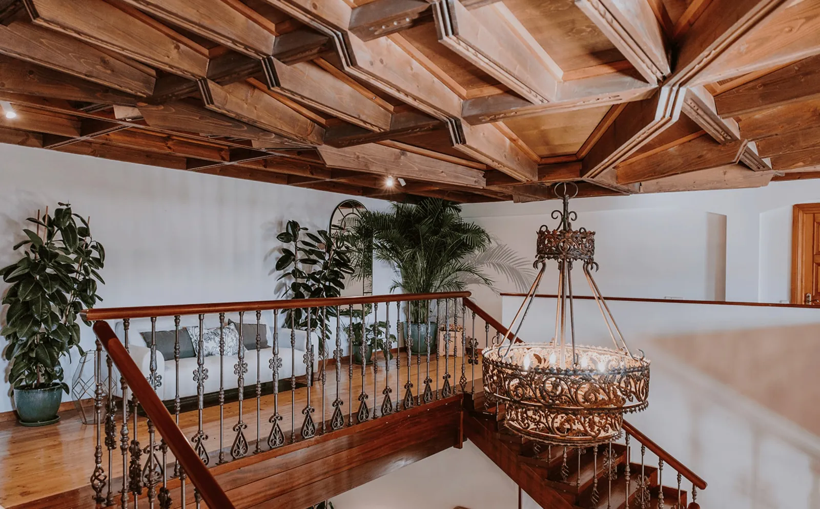 Coffered wooden ceiling and chandelier at Dehesa de Abantos near Madrid, event room