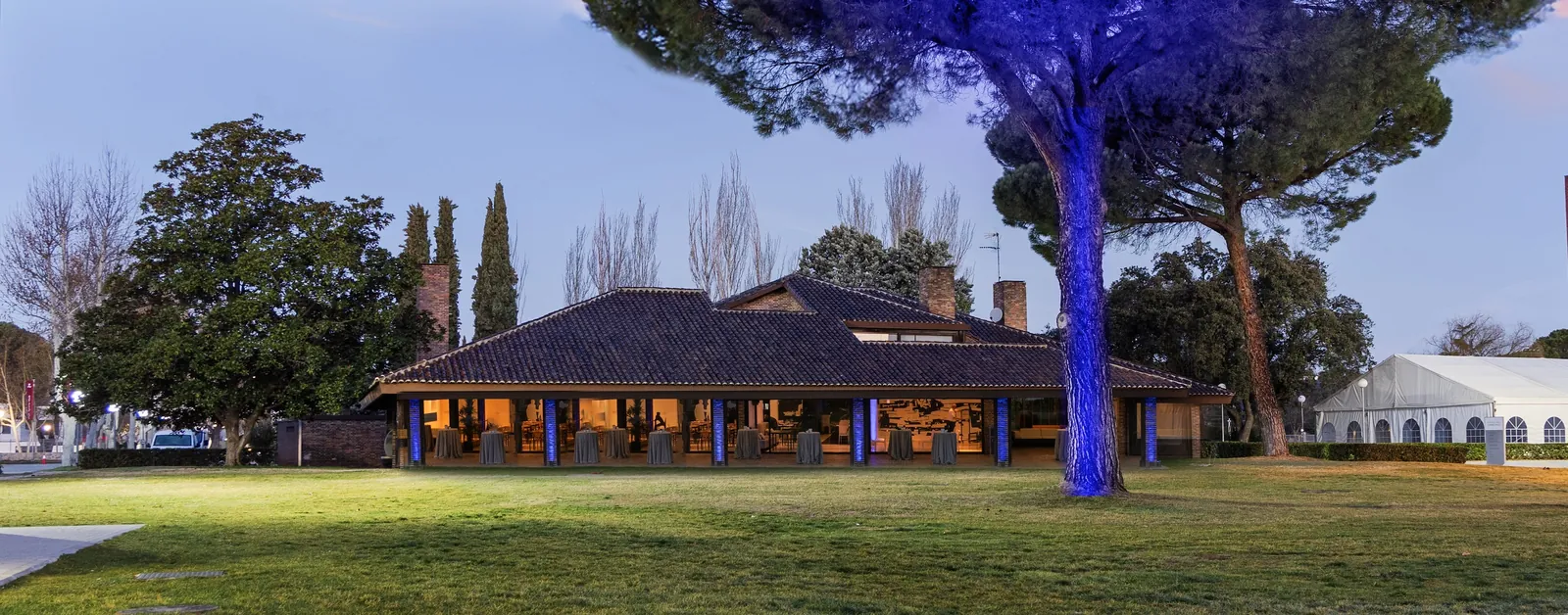 The Espacio Villafranca villa at dusk in its grounds