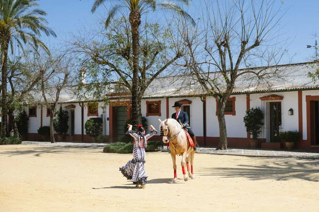 Courtyard of Hacienda de Orán near Seville with a horse and a flamenco dancer
