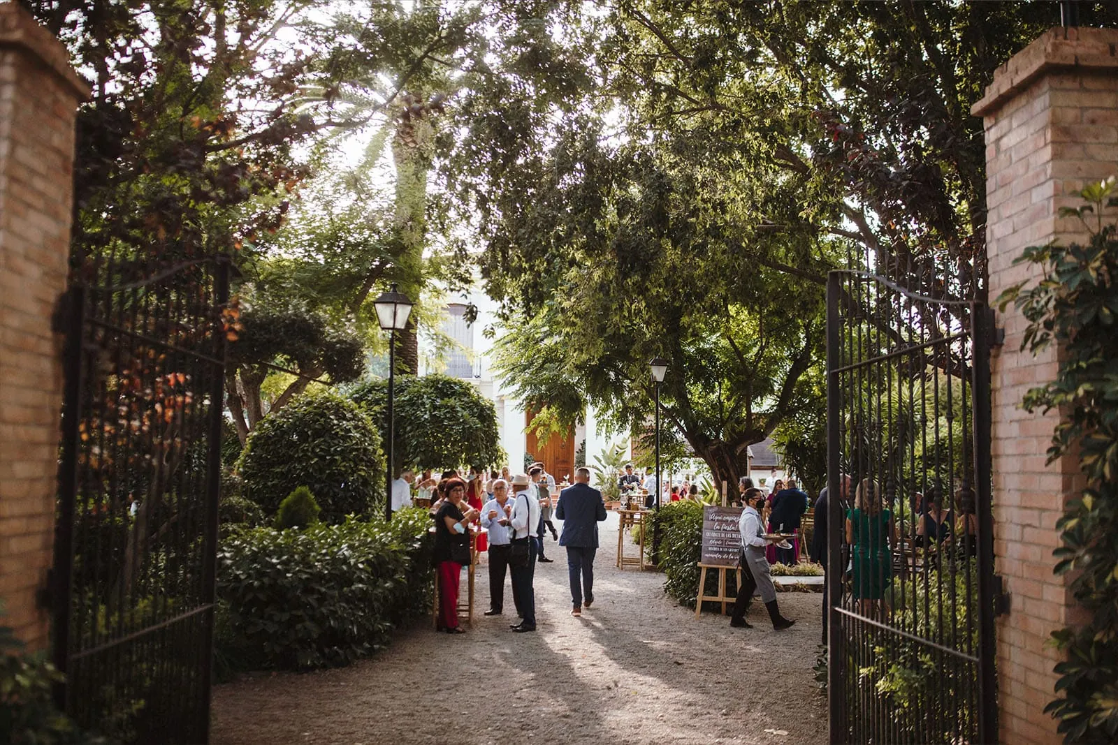 Shaded entrance to the masía between the trees