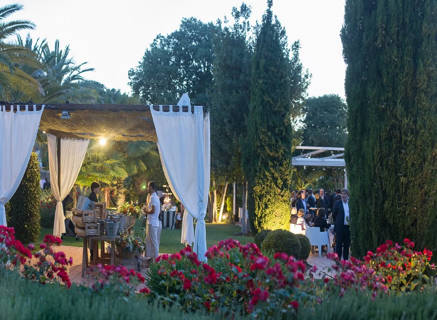 Garden and pergola of Masía Aldamar near Valencia, with garlands and flowers
