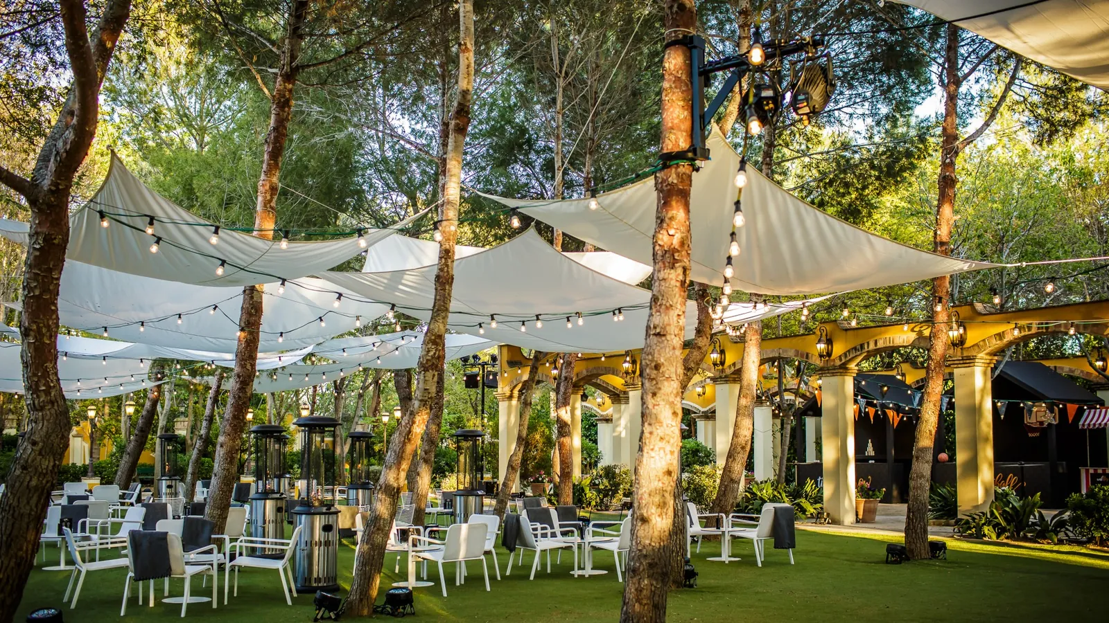 Large white marquee on the masía lawn
