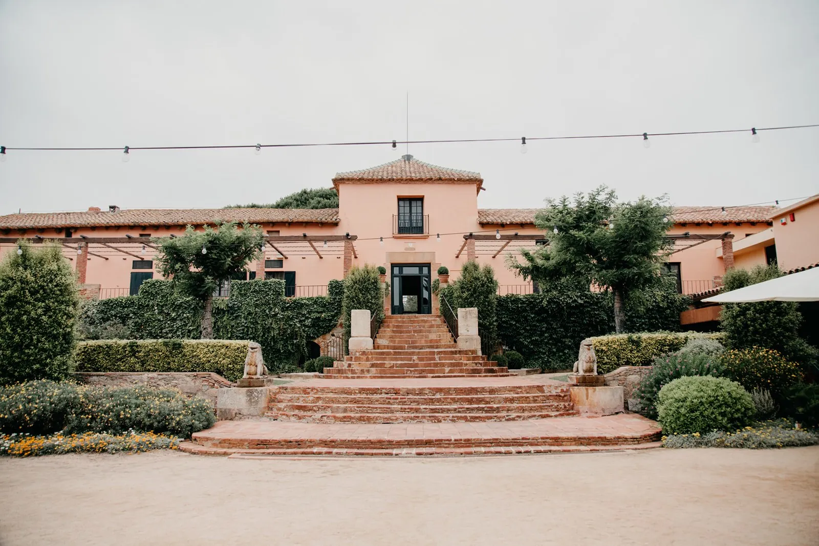 Facade and steps of La Torre dels Lleons near Barcelona, gardens for events