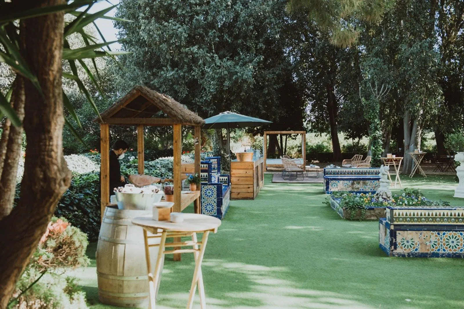 Lawn banquet area with a wooden kiosk
