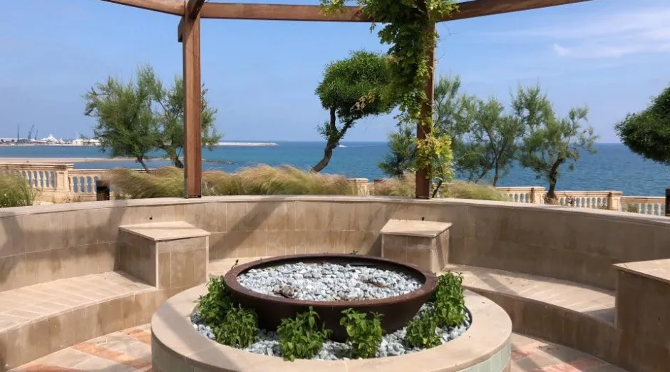 Terrace of Xalet del Nin with fire pit and sea view